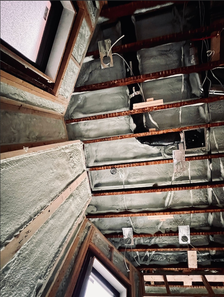 Spray foam installer at work